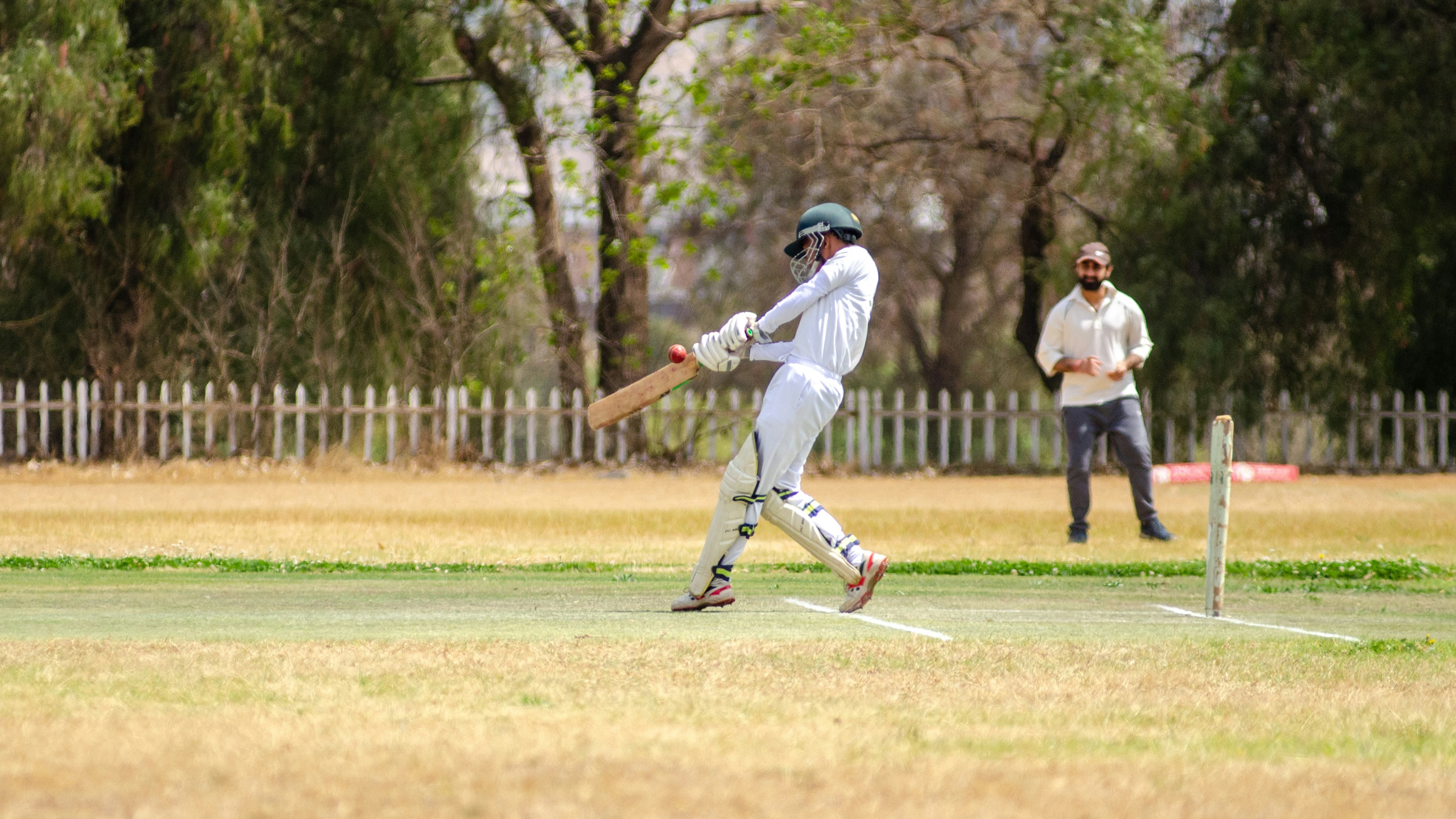 student playing cricket on school trip